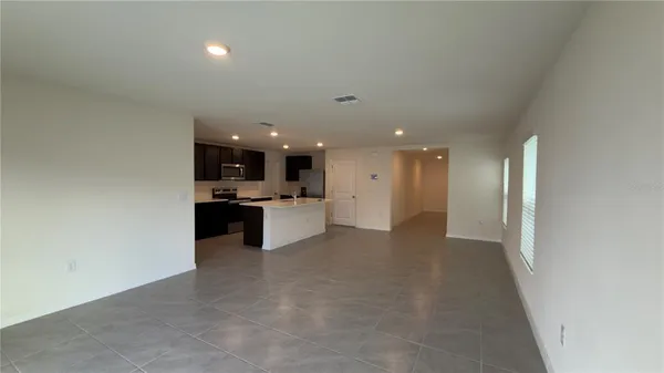 a view of a kitchen with a sink and cabinets