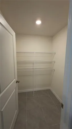 a view of storage and utility room with empty racks