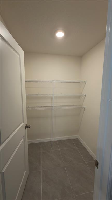 8632 Southwest 45th Court Ocala, FL 34476 - Photo 14 of 41 a view of storage and utility room with empty racks