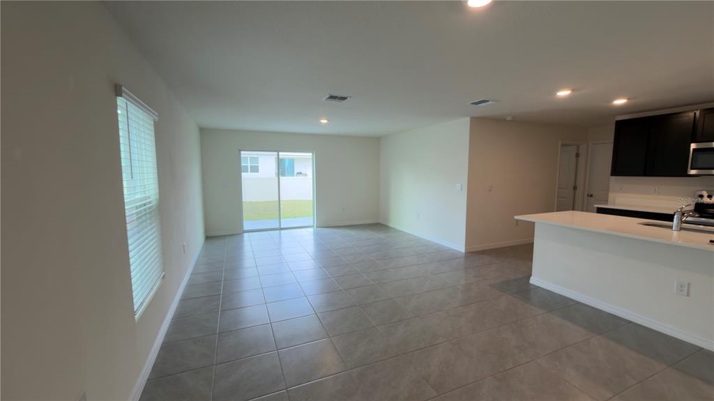 8632 Southwest 45th Court Ocala, FL 34476 - Photo 3 of 41 a view of a livingroom with a fireplace