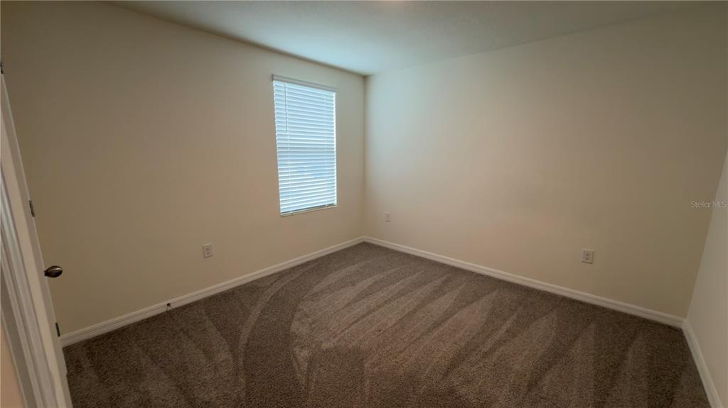8632 Southwest 45th Court Ocala, FL 34476 - Photo 31 of 41 an empty room with a window