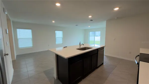 a kitchen with a sink and stove