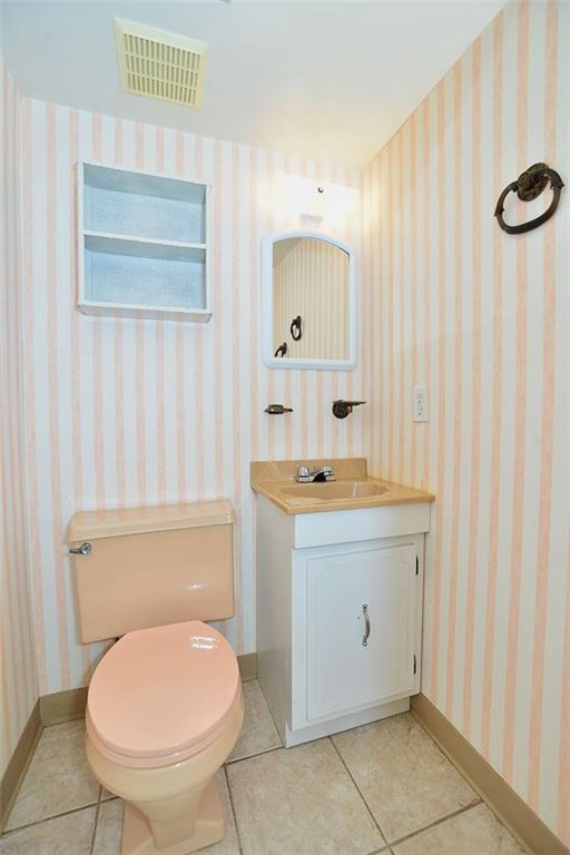 691 Kelso Road Pittsburgh, PA 15243 - Photo 14 of 18 Lower level powder room includes ceramic tile floor and vanity for storage. It is located near the game room.