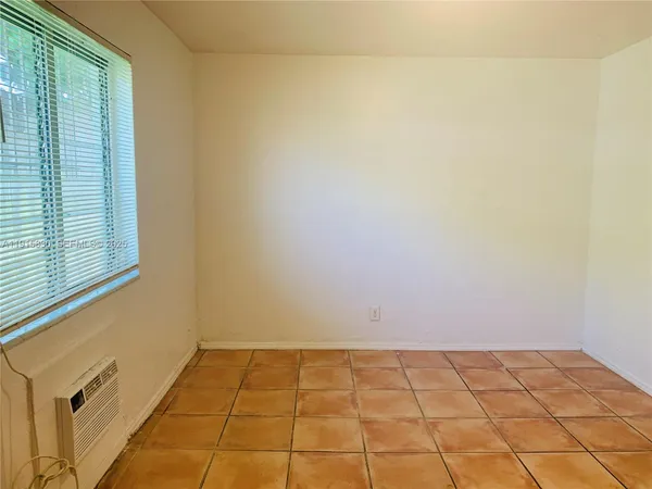 a view of a room with white walls
