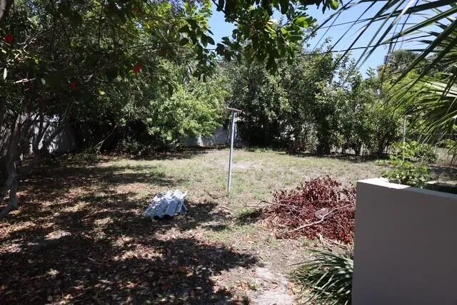 a view of a backyard of the house