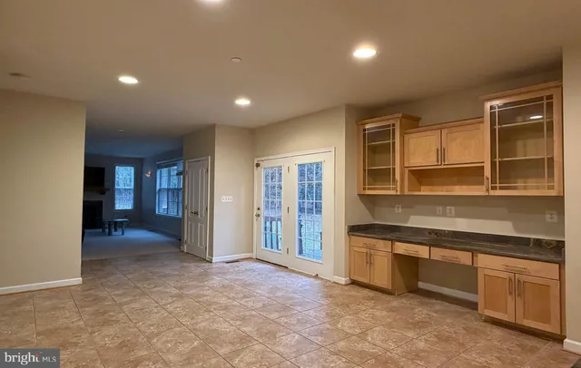 a view of a kitchen with a sink and cabinets