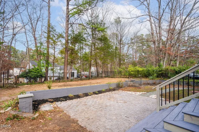 a street view with large trees