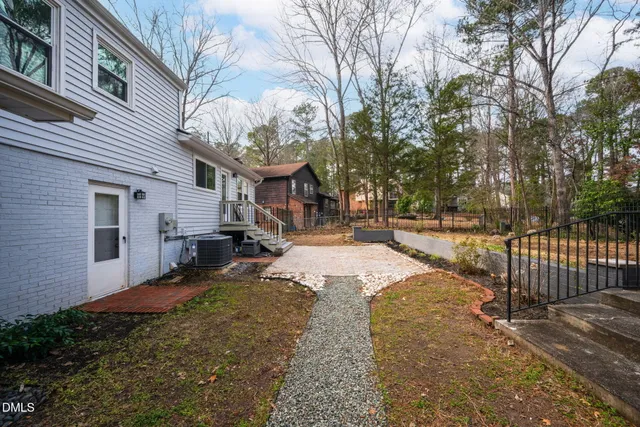 a view of a house with snow on the road