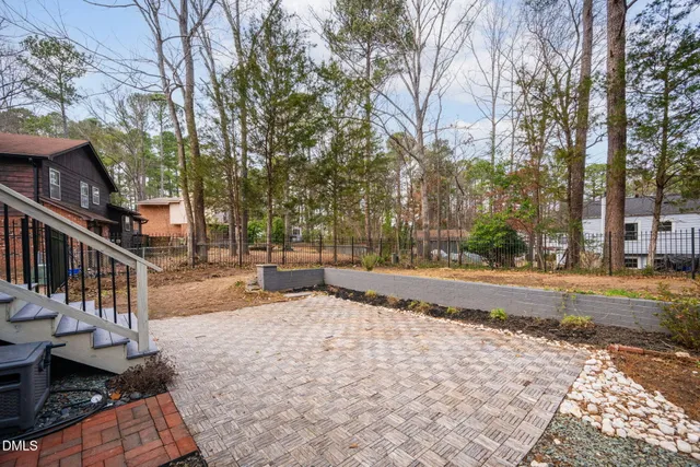 a house that has a tree in front of it