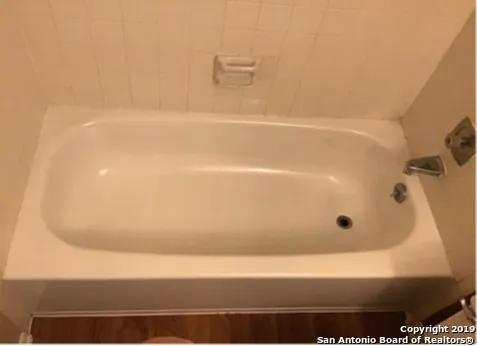 a bathroom with a bathtub