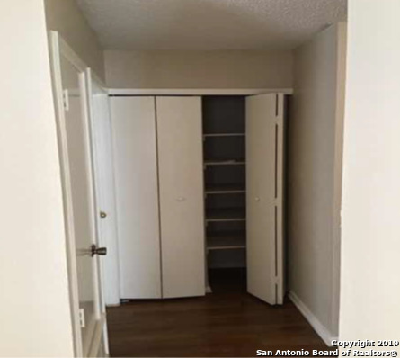 7904 Mallow San Antonio, TX 78239 - Photo 15 of 19 a view of walk in closet with empty racks
