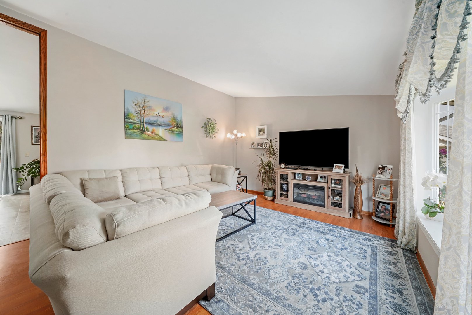 417 Pembroke Road Southwest Poplar Grove, IL 61065 - Photo 11 of 45 a living room with furniture and a flat screen tv