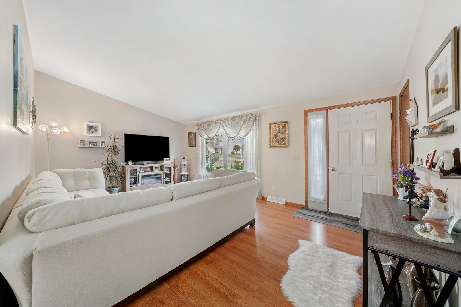 417 Pembroke Road Southwest Poplar Grove, IL 61065 - Photo 12 of 45 a living room with furniture and a flat screen tv
