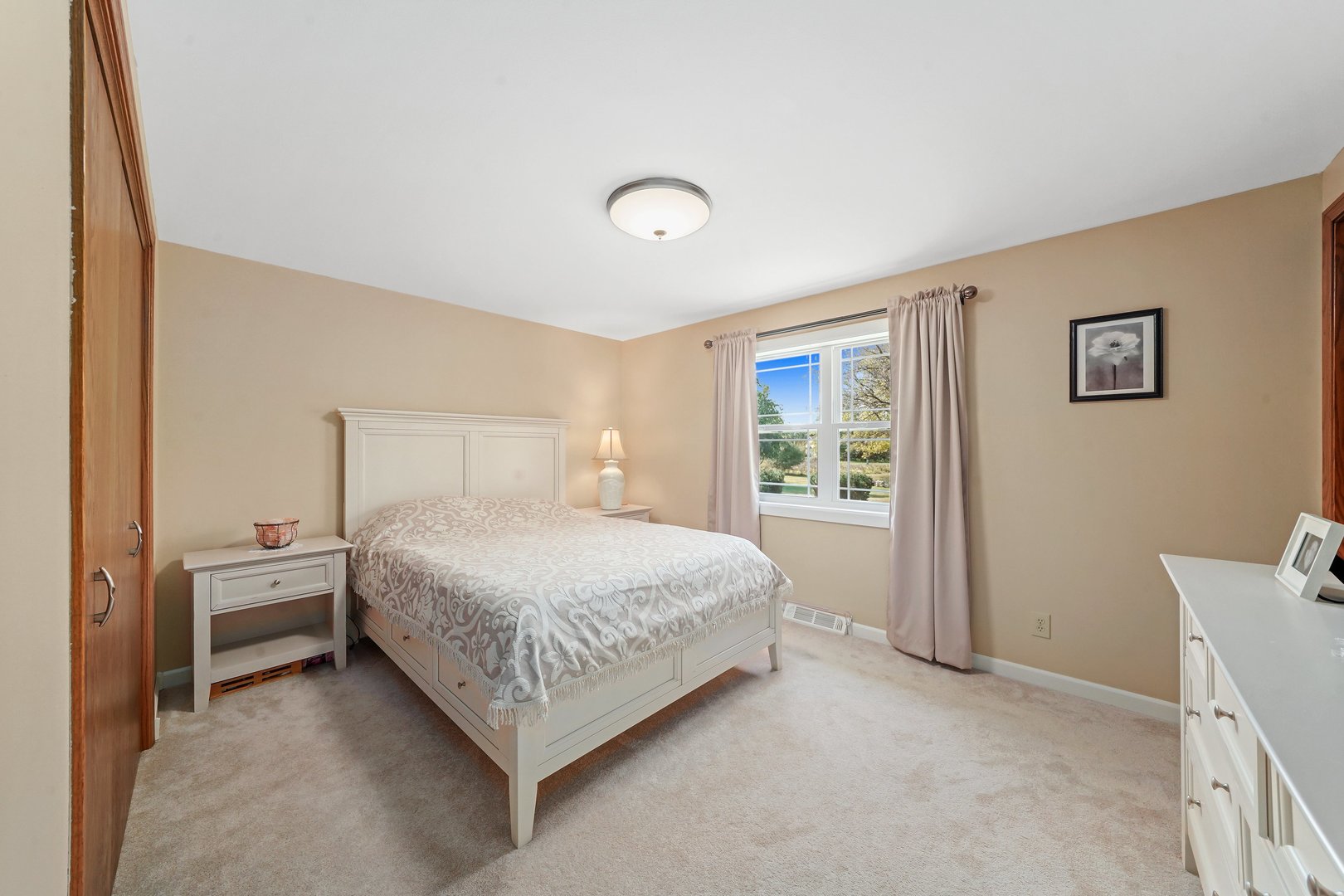 417 Pembroke Road Southwest Poplar Grove, IL 61065 - Photo 13 of 45 a bedroom with a bed and a window