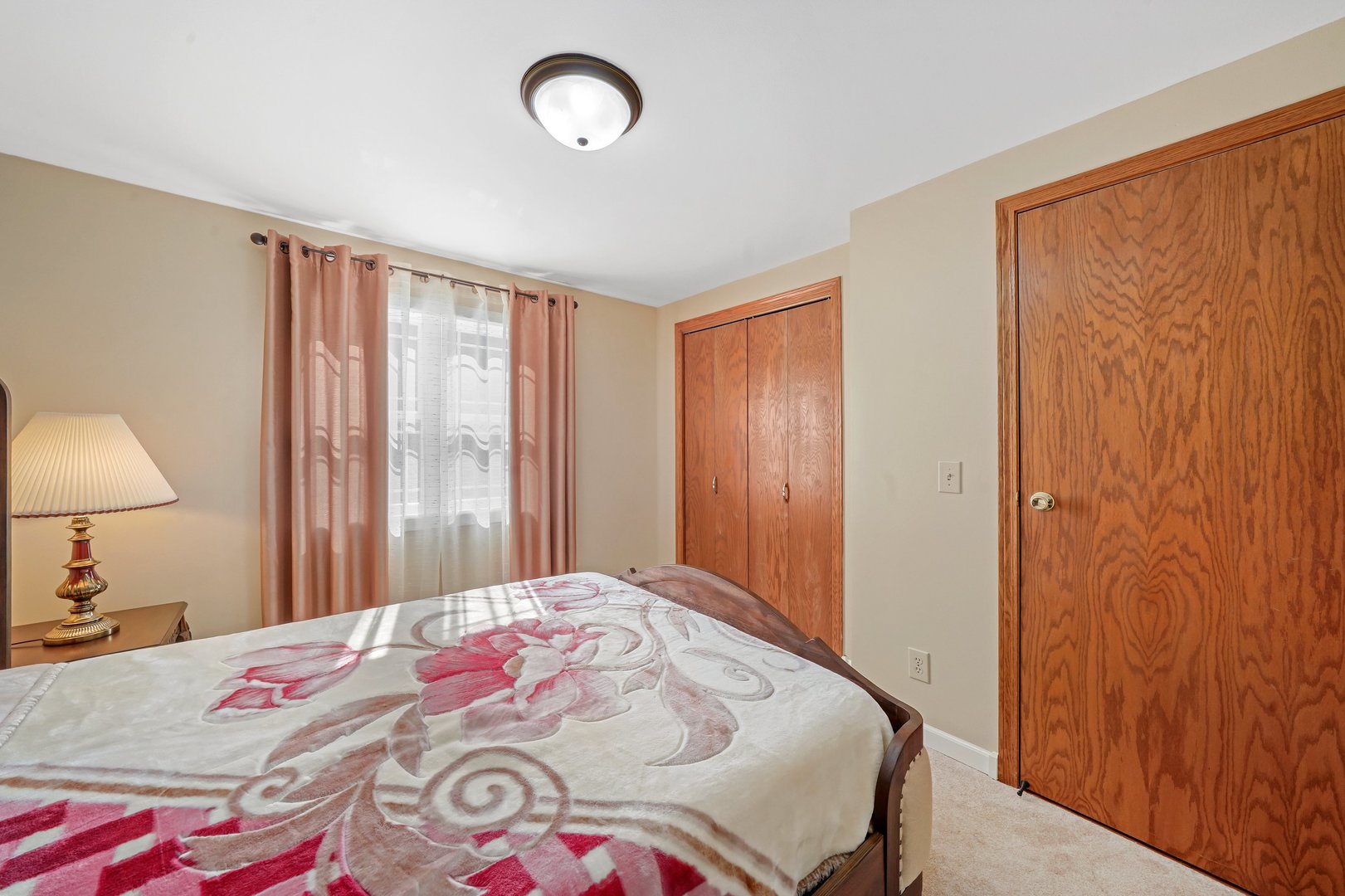 417 Pembroke Road Southwest Poplar Grove, IL 61065 - Photo 17 of 45 a bedroom with a bed and a lamp