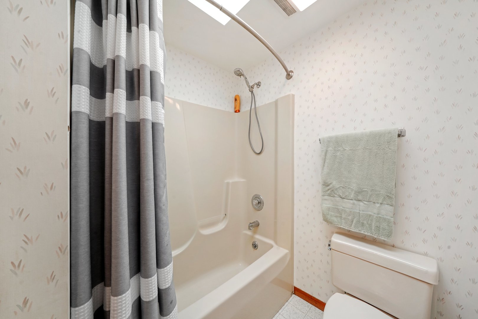 417 Pembroke Road Southwest Poplar Grove, IL 61065 - Photo 21 of 45 a bathroom with a bathtub and a shower