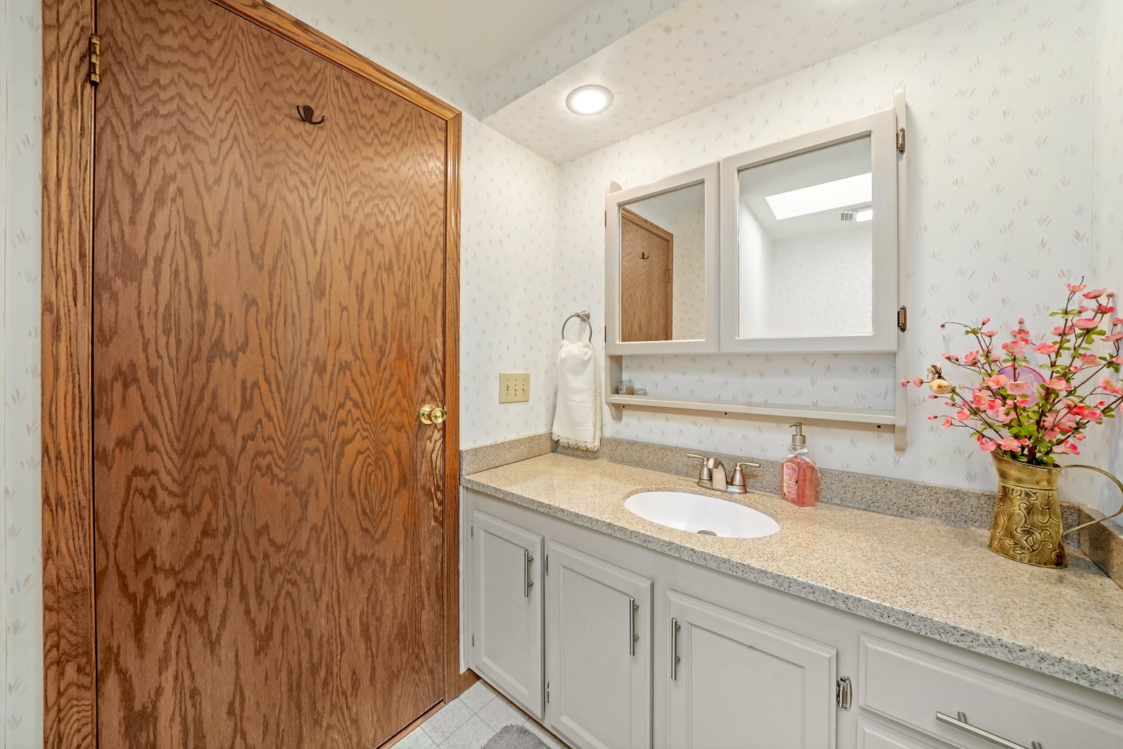 417 Pembroke Road Southwest Poplar Grove, IL 61065 - Photo 22 of 45 a bathroom with a granite countertop sink and a mirror