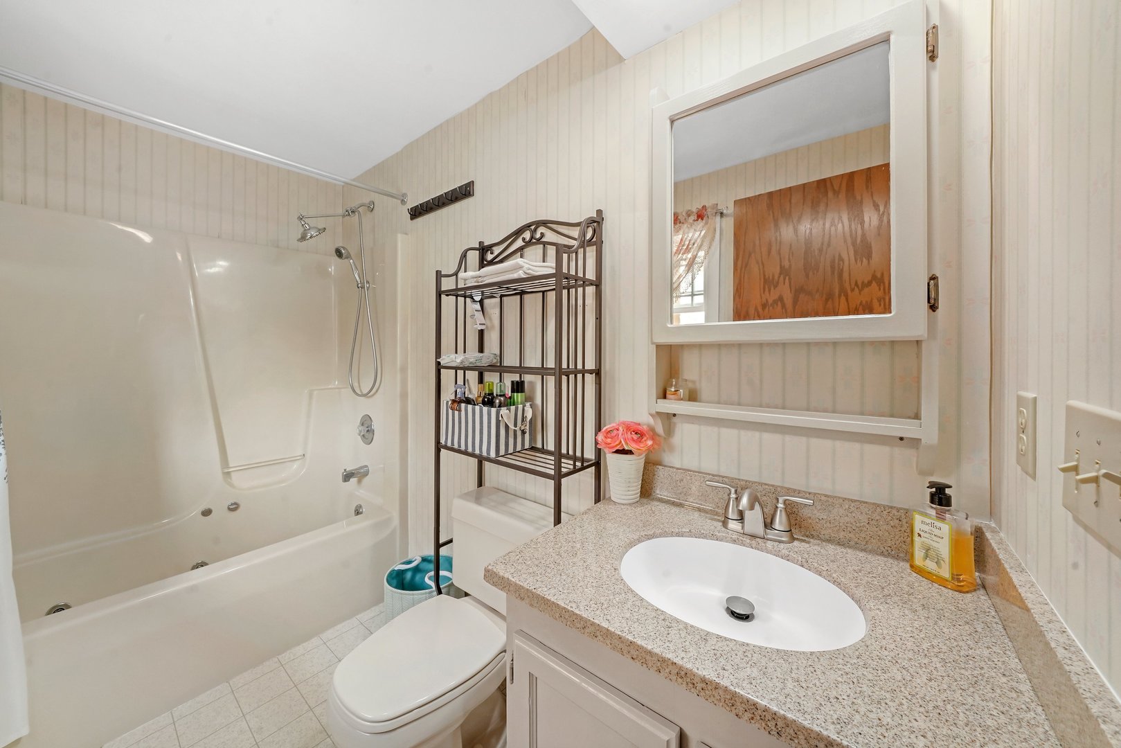 417 Pembroke Road Southwest Poplar Grove, IL 61065 - Photo 23 of 45 a bathroom with a granite countertop sink toilet a mirror and shower