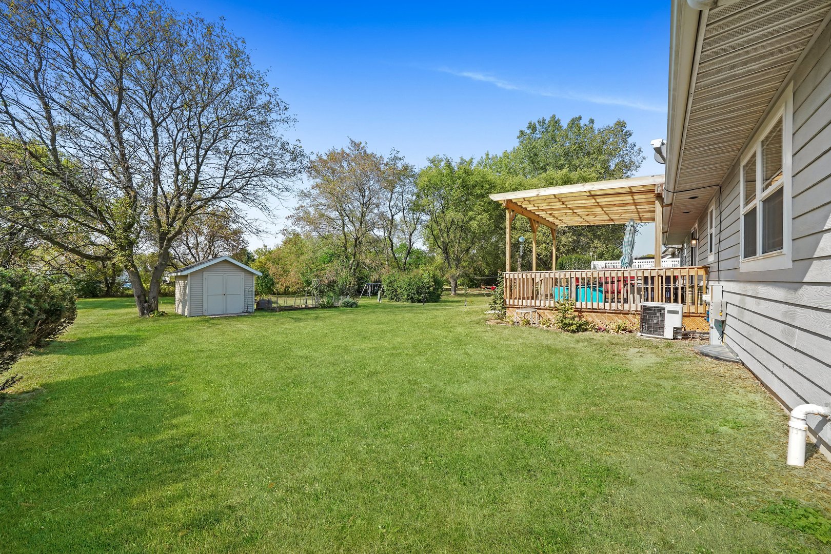 417 Pembroke Road Southwest Poplar Grove, IL 61065 - Photo 29 of 45 a view of a house with backyard and sitting area