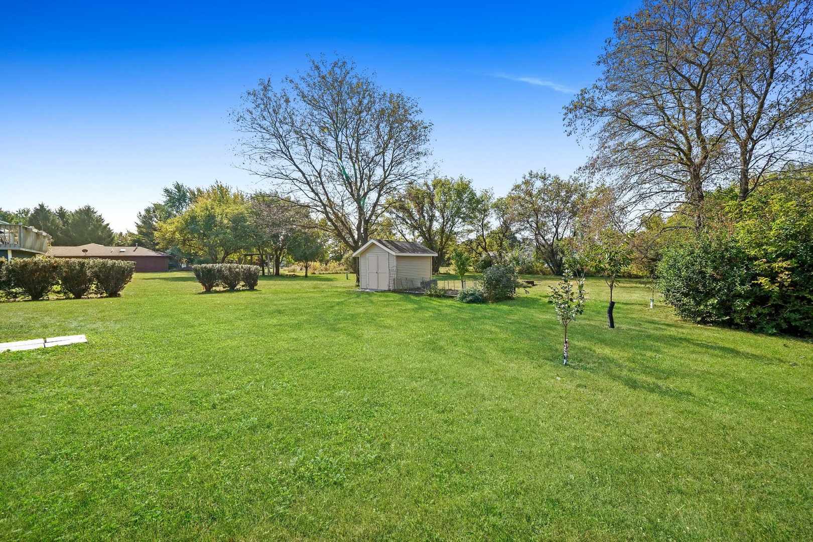 417 Pembroke Road Southwest Poplar Grove, IL 61065 - Photo 37 of 45 a view of a house with a big yard