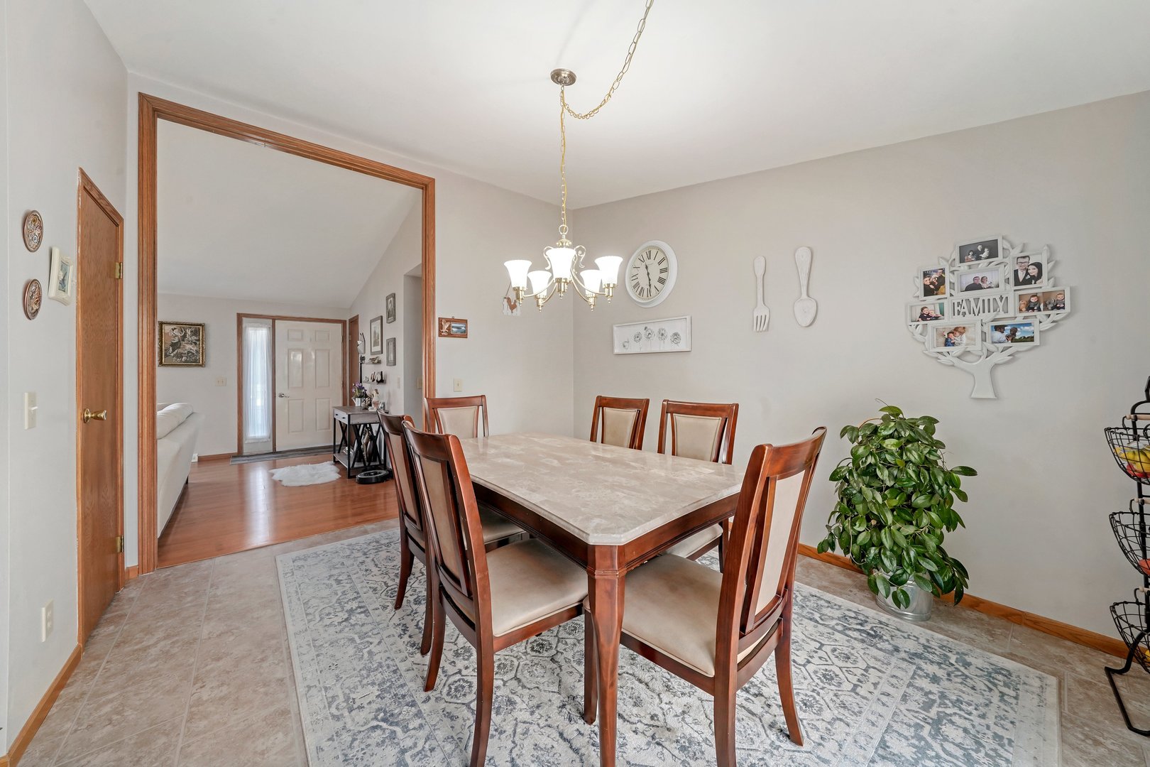 417 Pembroke Road Southwest Poplar Grove, IL 61065 - Photo 7 of 45 a view of a dining room with furniture and chandelier