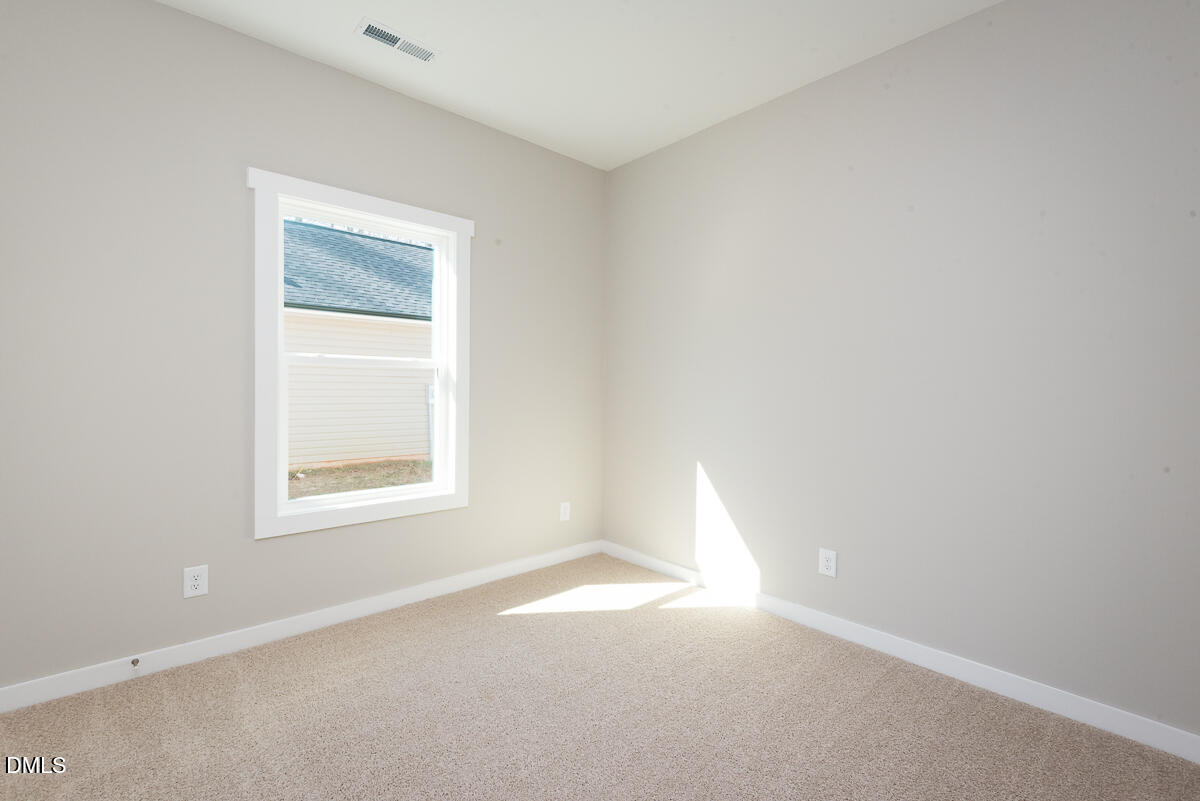 2828 Ricolden Trail Elon, NC 27244 - Photo 7 of 14 an empty room with a window