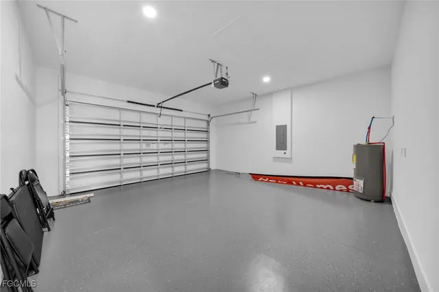 a view of a house with a big yard plants and large trees