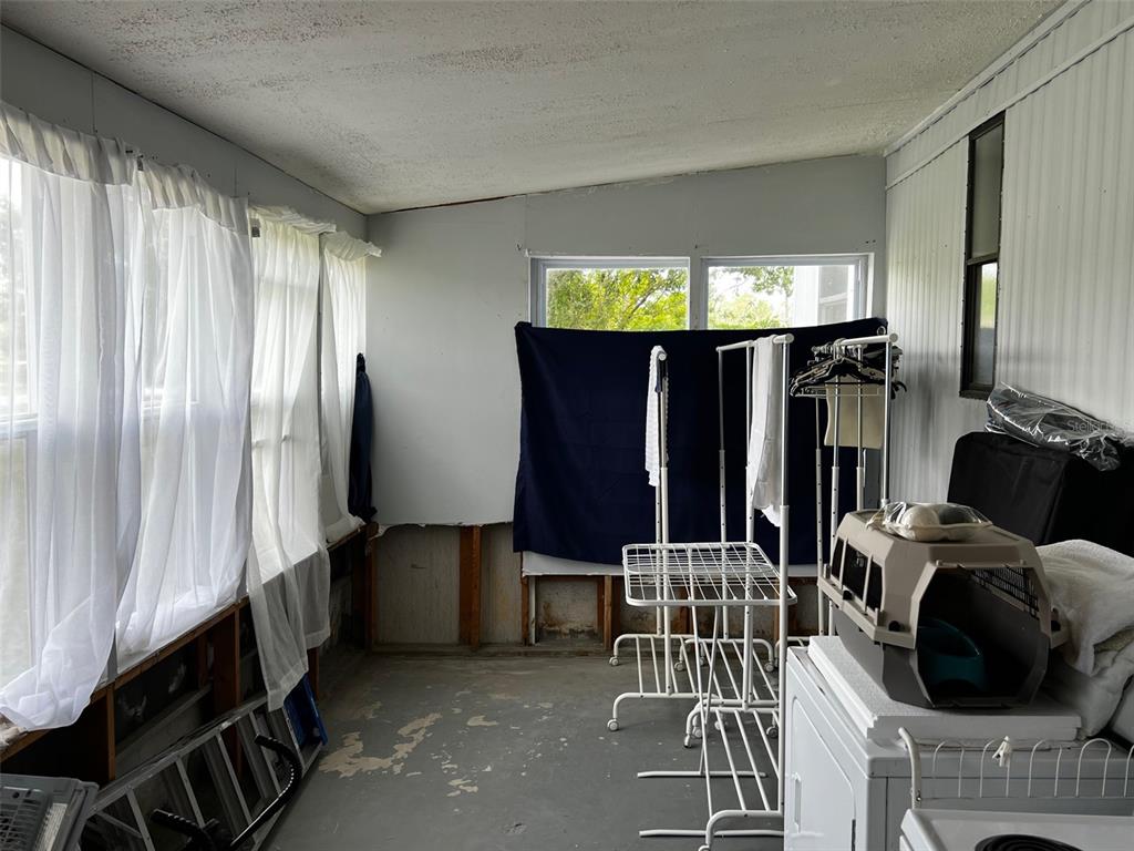 1670 Liberty Bell Street Kissimmee, FL 34758 - Photo 5 of 25 a view of a chairs and a room with furniture and a window