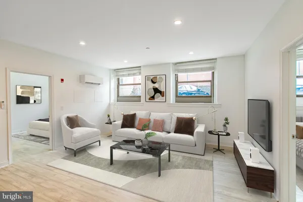 a large kitchen with stainless steel appliances granite countertop a refrigerator and a sink