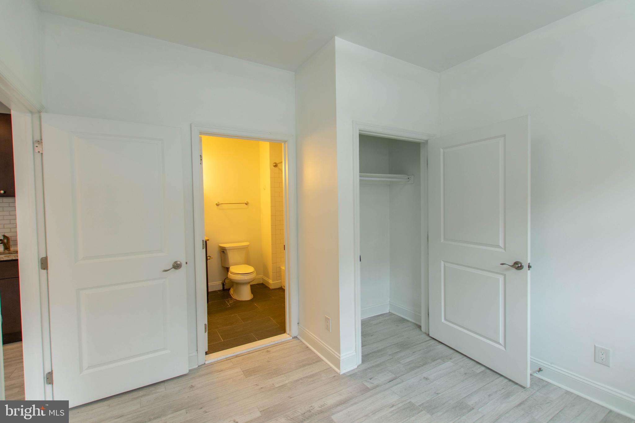 427-33 Monroe Street, Unit 102 Philadelphia, PA 19147 - Photo 13 of 23 a view of bathroom with a tub and a en suite bathroom