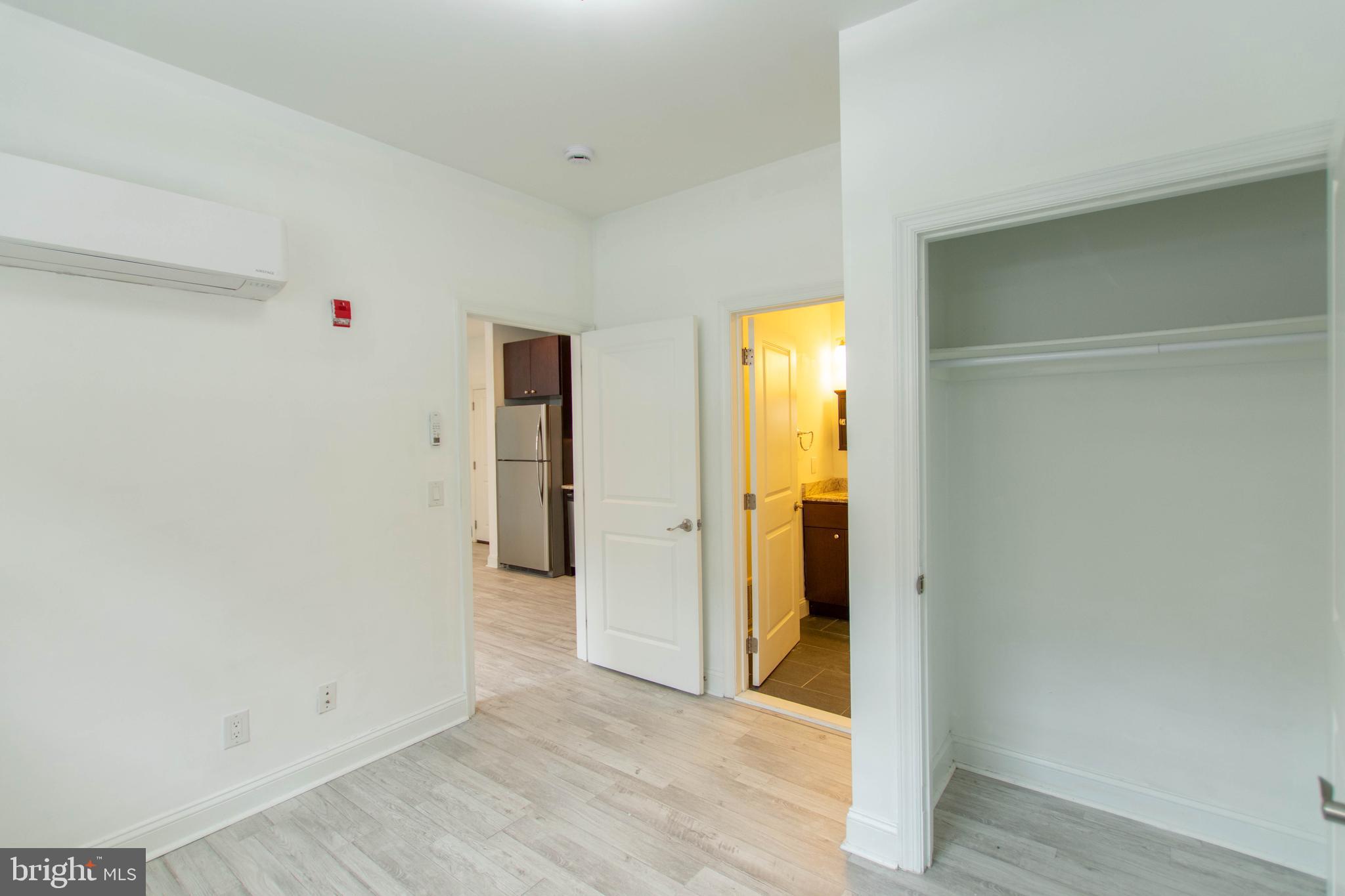 427-33 Monroe Street, Unit 102 Philadelphia, PA 19147 - Photo 14 of 23 a view of a room with wooden floor and a window