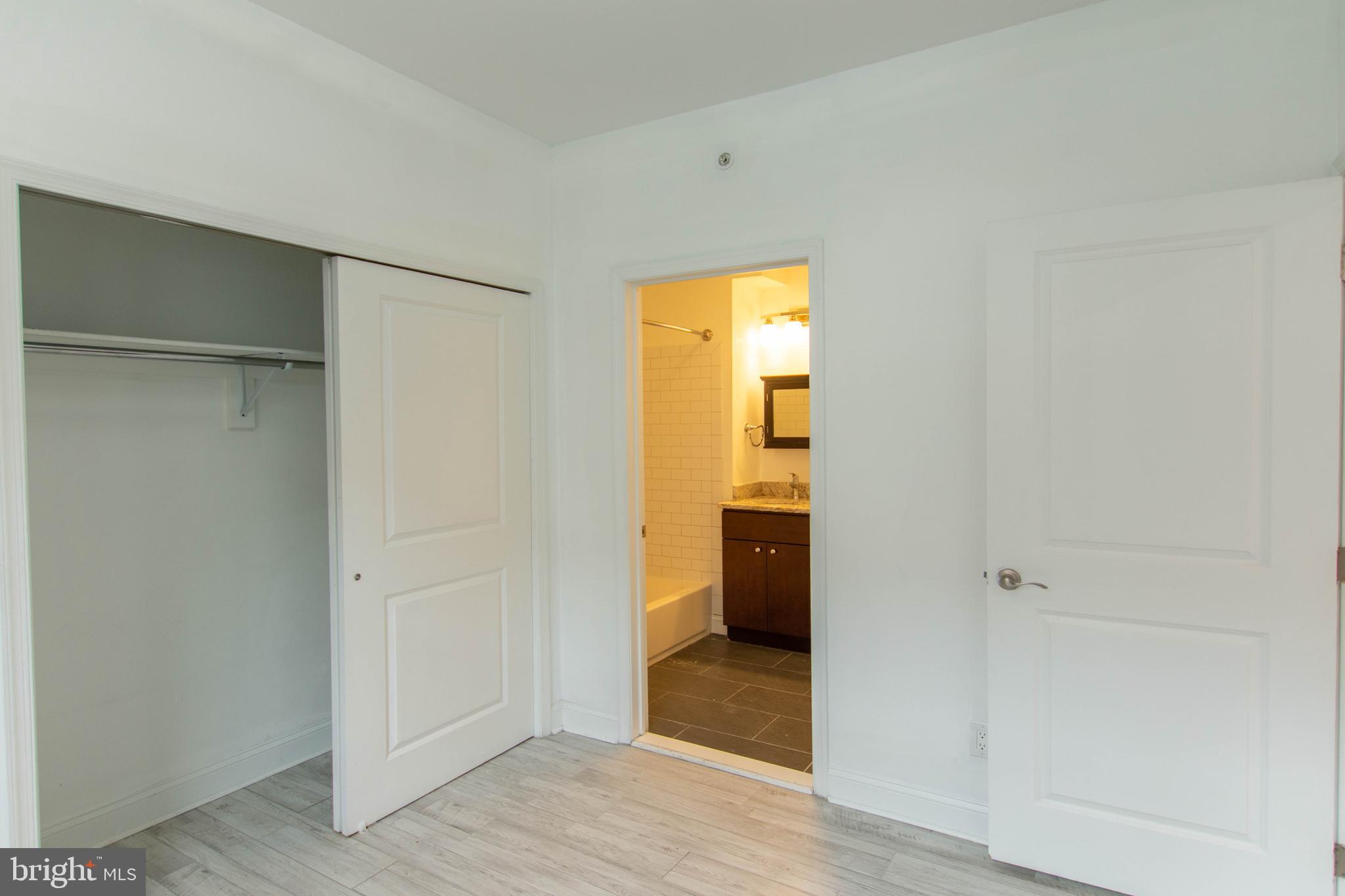 427-33 Monroe Street, Unit 102 Philadelphia, PA 19147 - Photo 19 of 23 a view of a room with a hallway