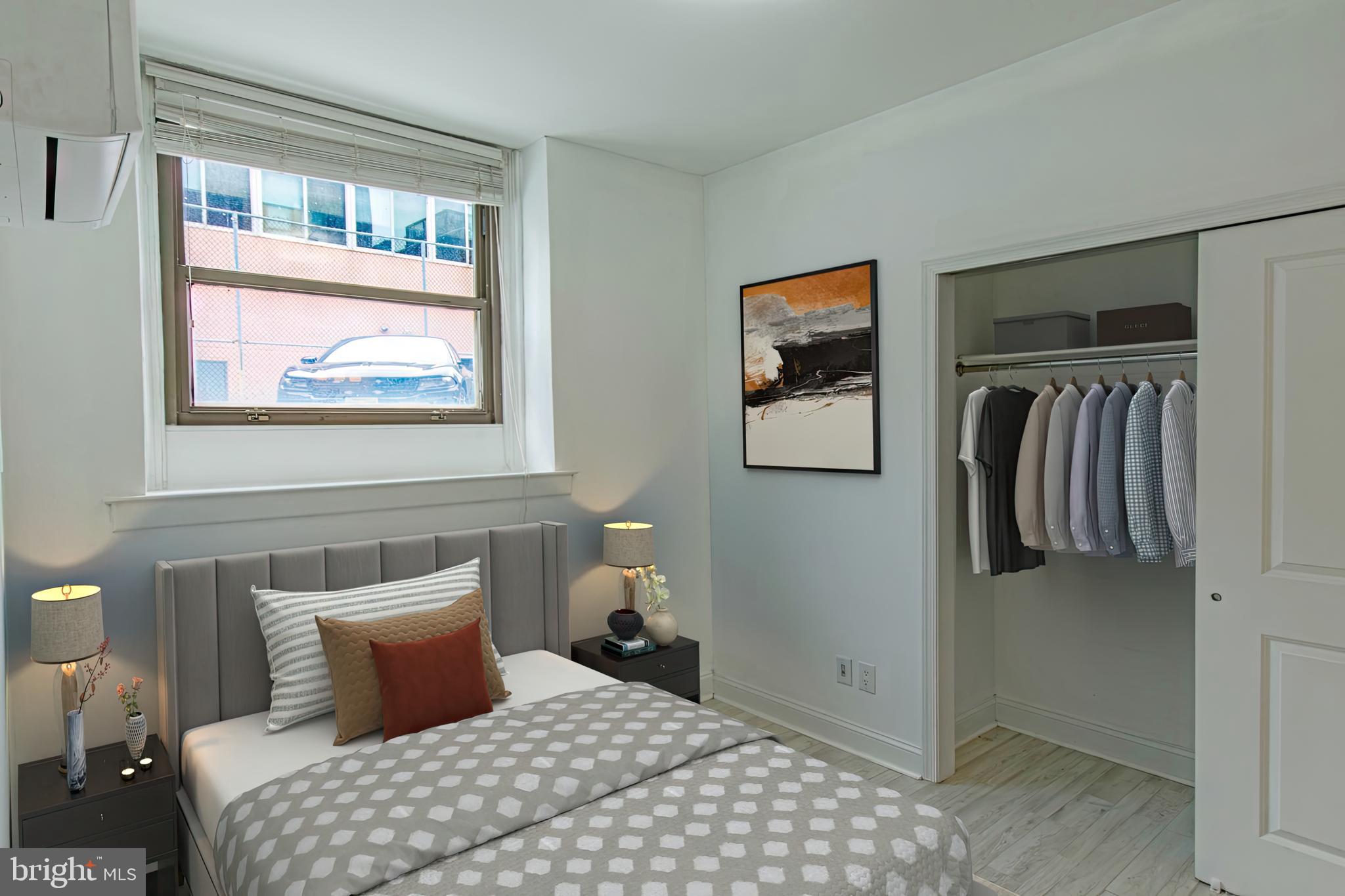427-33 Monroe Street, Unit 102 Philadelphia, PA 19147 - Photo 4 of 23 a bedroom with a bed and a window