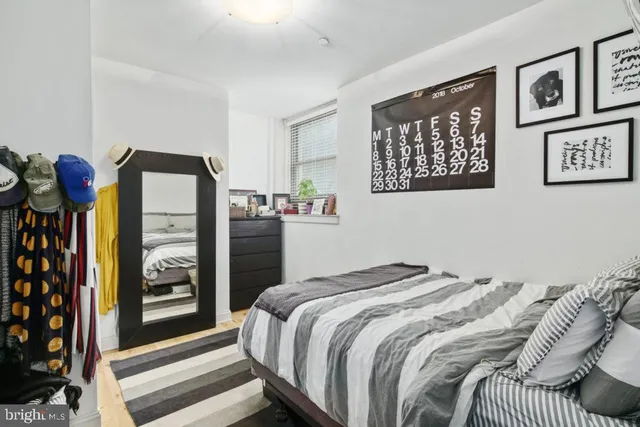 a bedroom with a bed and a walk in closet