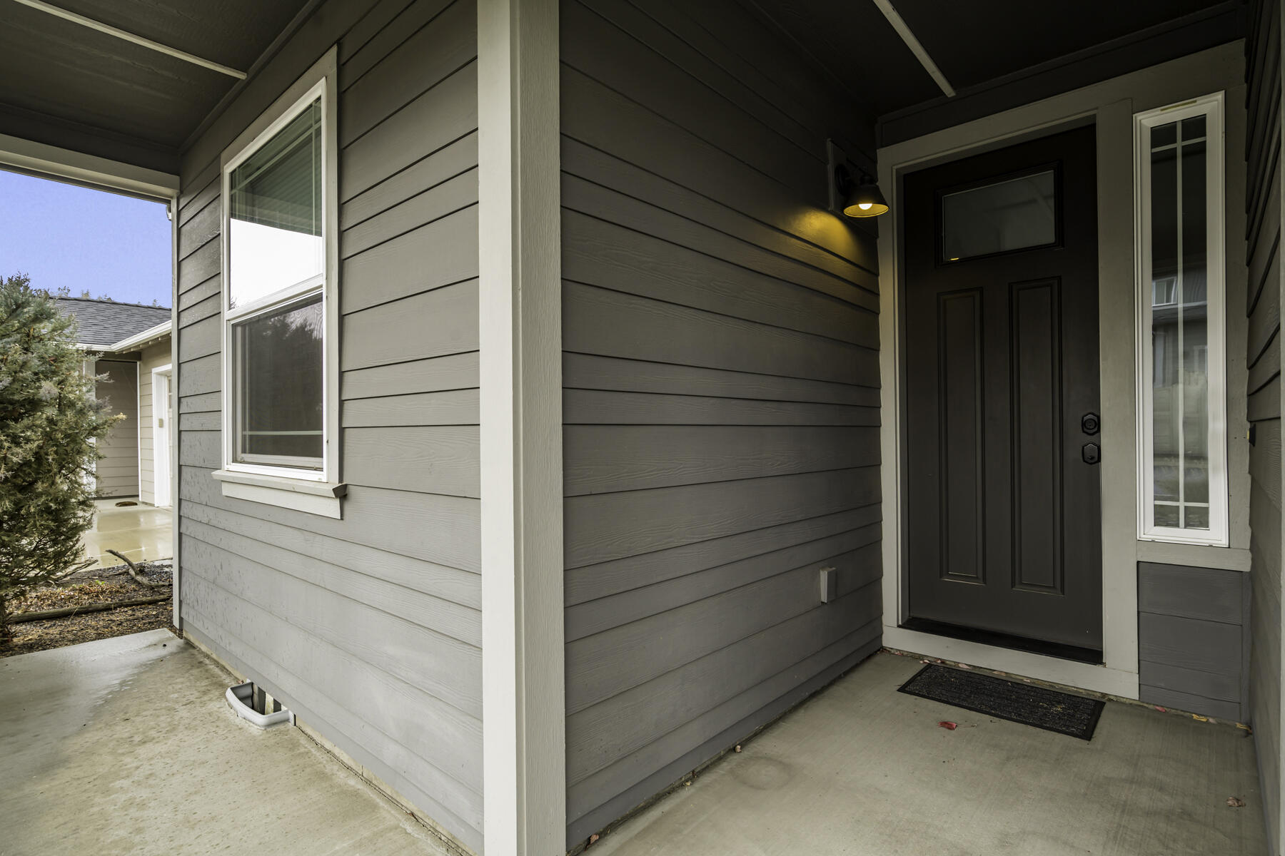 A small, patio welcomes you into the home...