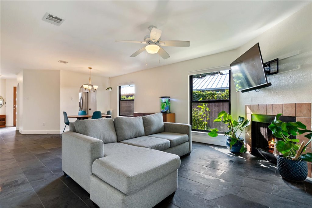 2506 Jenibeth Lane Austin, TX 78744 - Photo 11 of 23 Main living space with lots of natural light through new black-frame windows