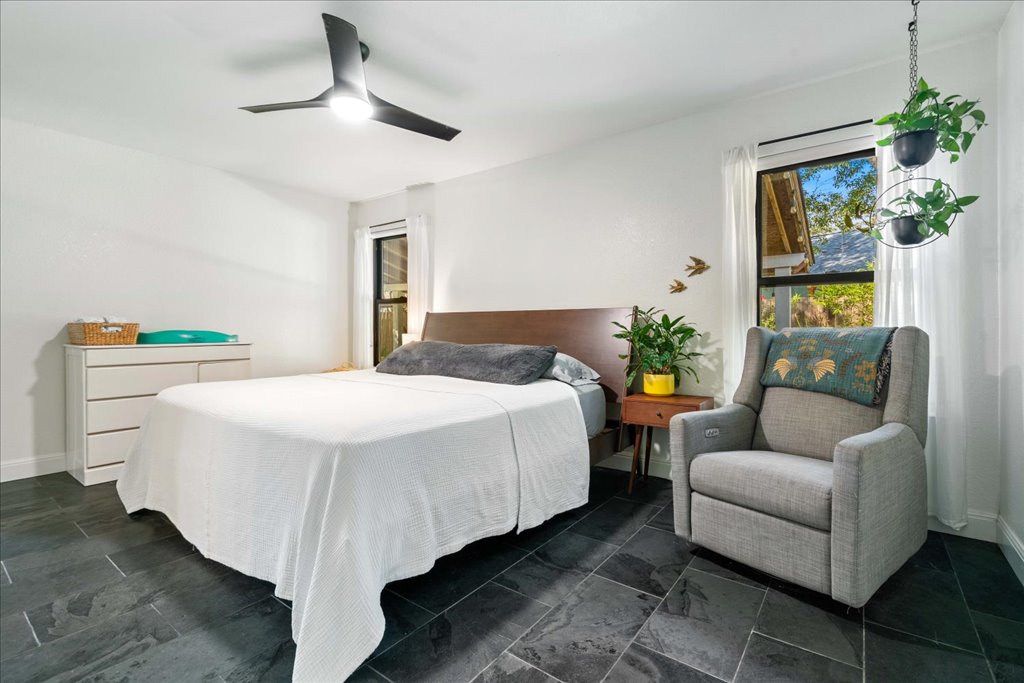 2506 Jenibeth Lane Austin, TX 78744 - Photo 13 of 23 Spacious primary bedroom with updated fan