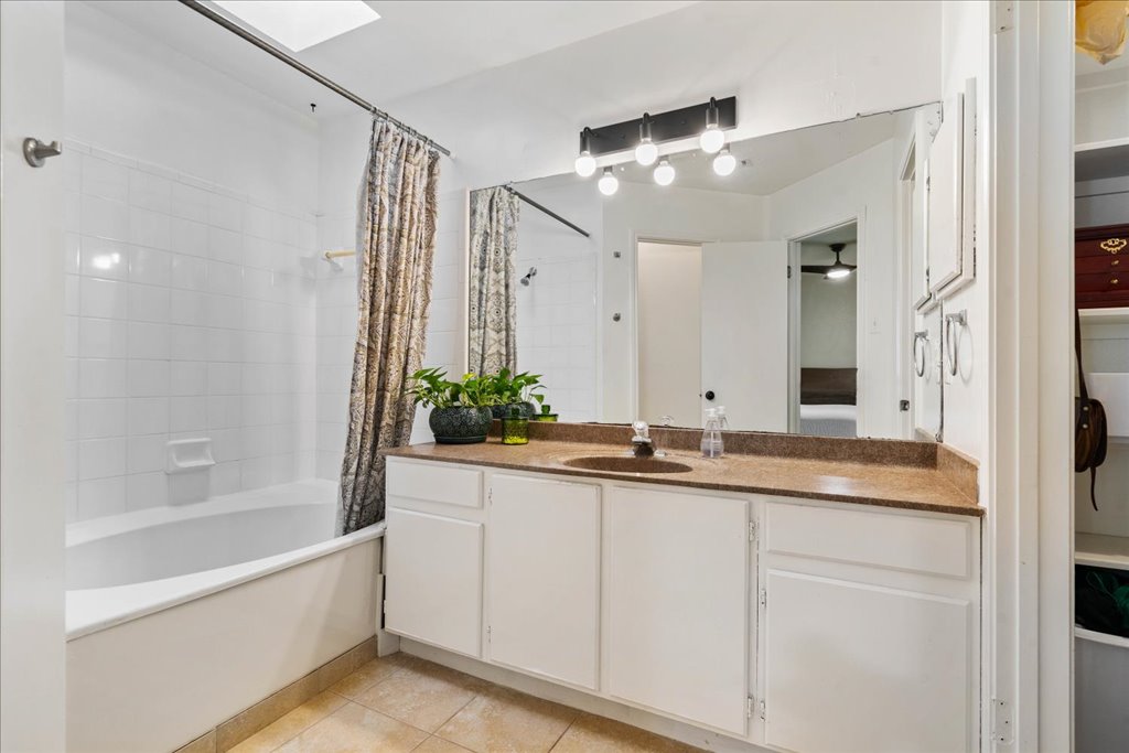 2506 Jenibeth Lane Austin, TX 78744 - Photo 15 of 23 Primary bathroom has a skylight over the large soaking tub