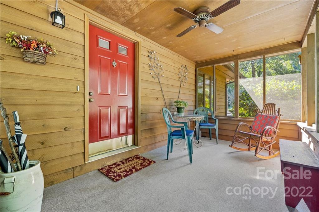 109 Mimosa Inn Tryon, NC 28782 - Photo 3 of 28 a view of a livingroom with furniture and a floor to ceiling window