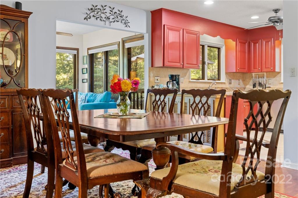 109 Mimosa Inn Tryon, NC 28782 - Photo 8 of 28 a view of a dining room with furniture and a potted plant