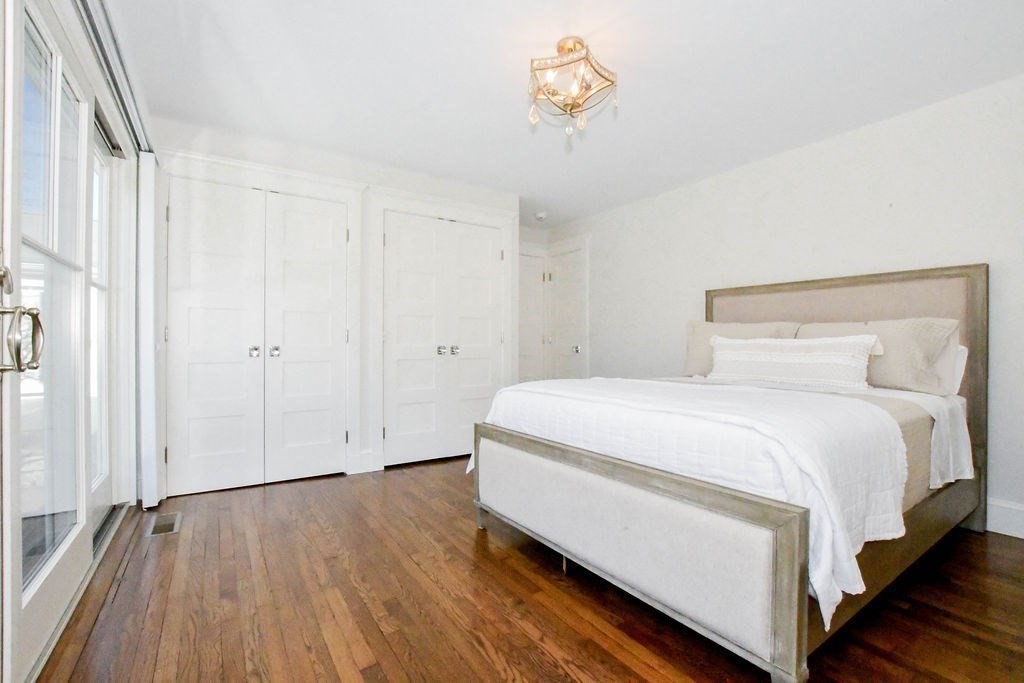37 Holmes Street Marion, MA 02738 - Photo 17 of 37 a spacious bedroom with a bed and a window