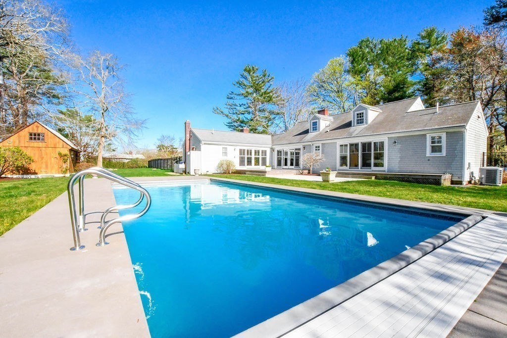 37 Holmes Street Marion, MA 02738 - Photo 2 of 37 a view of a house with pool and chairs