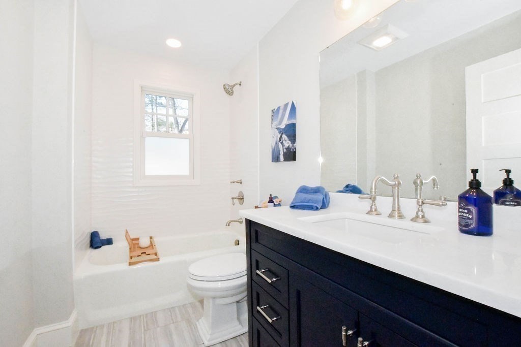 37 Holmes Street Marion, MA 02738 - Photo 23 of 37 a bathroom with a sink a toilet and a mirror