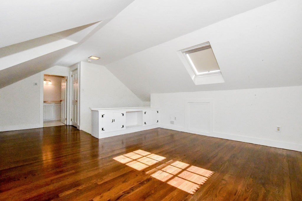 37 Holmes Street Marion, MA 02738 - Photo 27 of 37 an empty room with wooden floor and windows