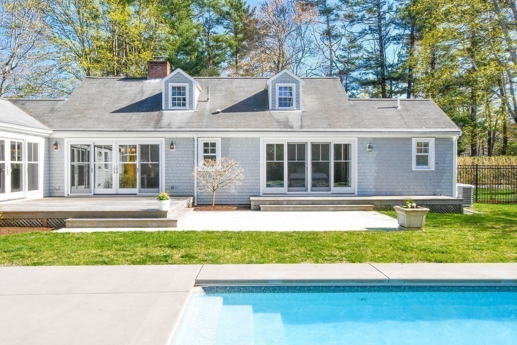 37 Holmes Street Marion, MA 02738 - Photo 30 of 37 a house that has a big yard with potted plants and a large tree