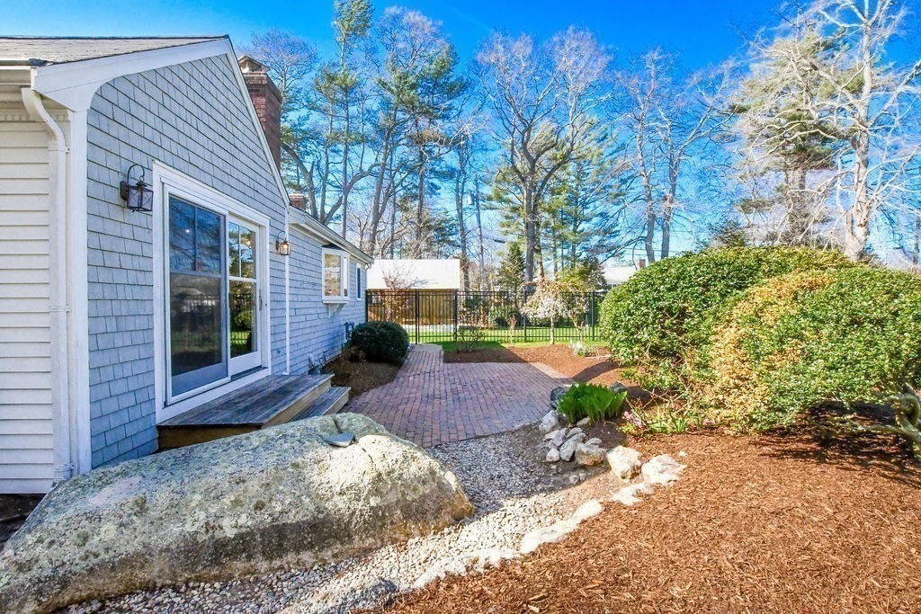 37 Holmes Street Marion, MA 02738 - Photo 33 of 37 a view of yellow house with a yard and sitting area