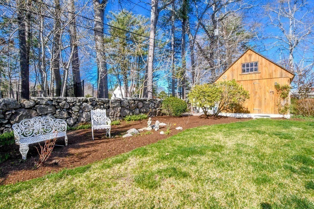 37 Holmes Street Marion, MA 02738 - Photo 34 of 37 a view of a chair and table in backyard of the house
