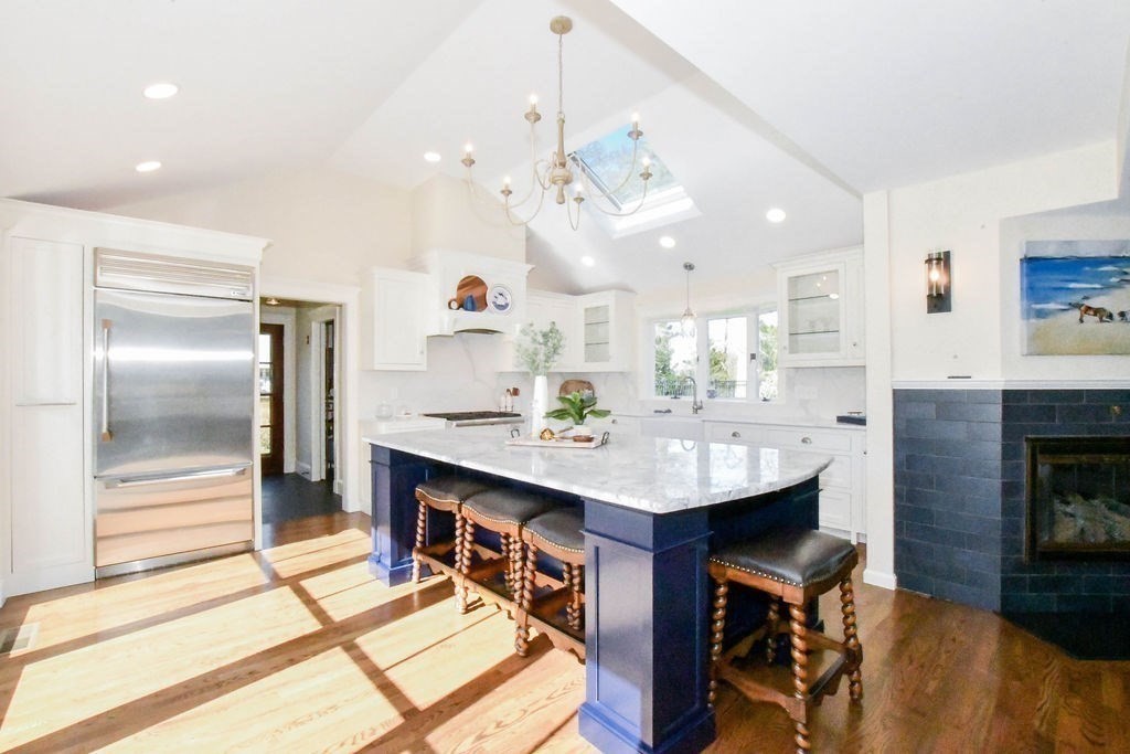37 Holmes Street Marion, MA 02738 - Photo 6 of 37 a view of a kitchen with kitchen island a sink stainless steel appliances and living room view