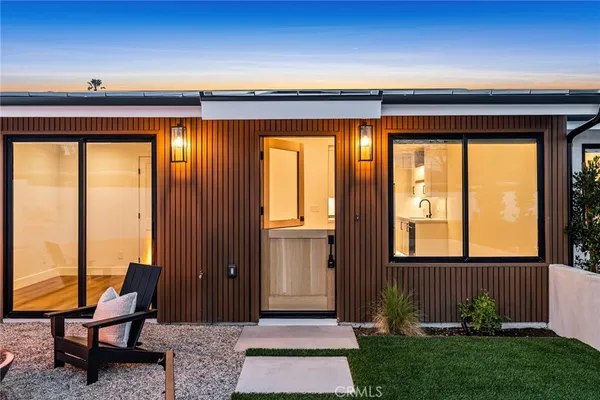 a front view of house with outdoor seating