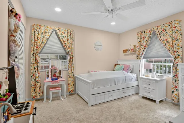 a bedroom with a bed and a table in it